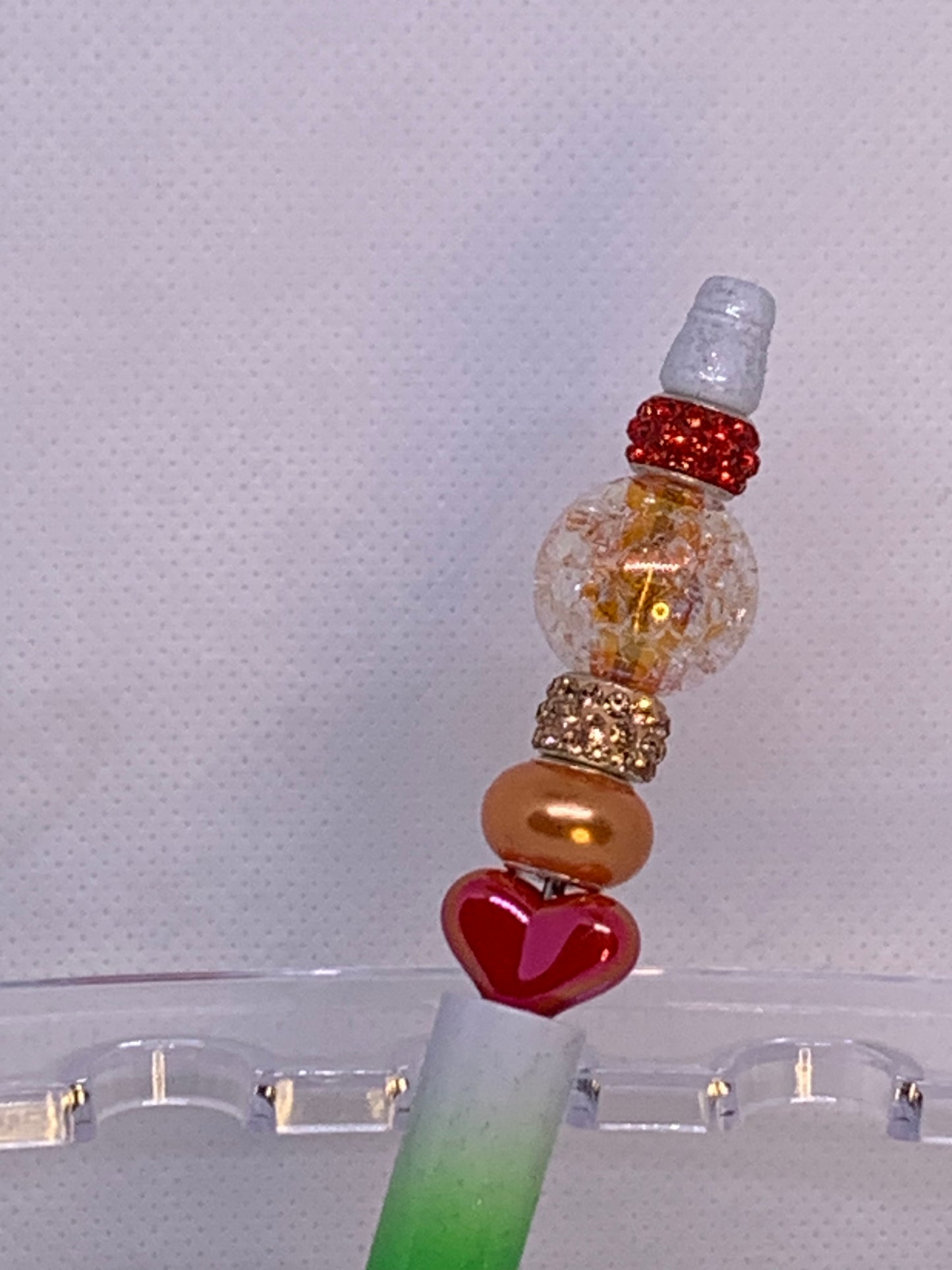 Shiny peach, orange beads with fancy Chunky red-orange heart