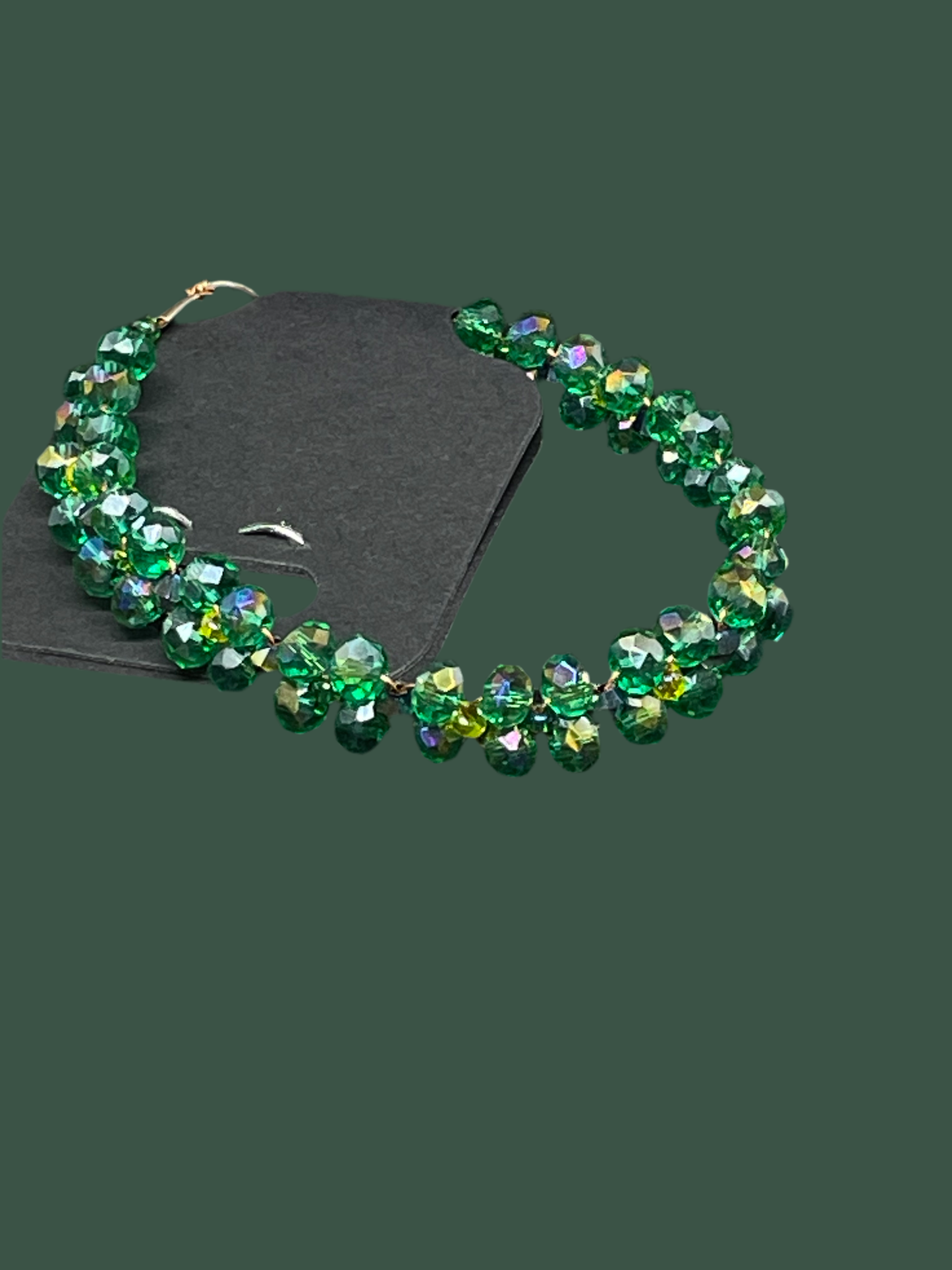 Stylish Green braided Crystal Bracelet - this elegant green crystal bracelet displayed with green background is any girls dream 