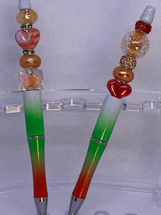 Shiny peach, orange beads with fancy Chunky red-orange heart