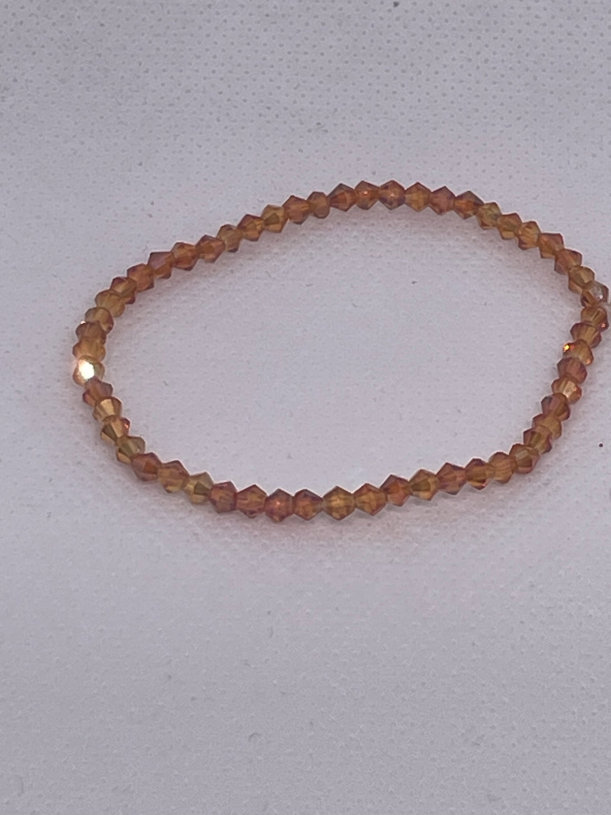 COPPER TAN AB BICONE 4mm
Australian Crystal Beads stretchy Bracelet