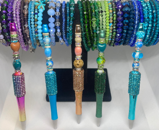 Customizable crystal stretch bracelets with durable, sparkling beads.
