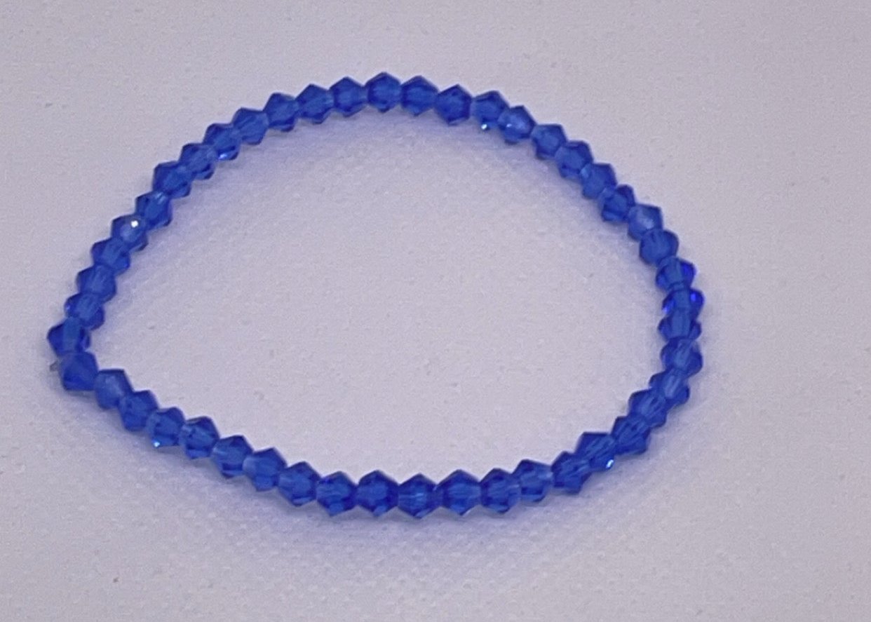 Deep blue crystal beaded stretch bracelet with faceted glass beads