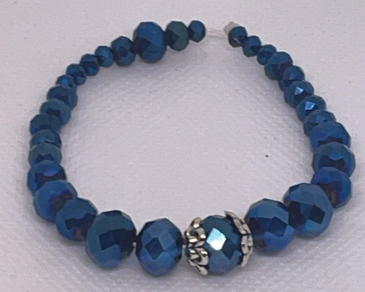 Iridescent blue and clear crystal bracelet with aurora borealis finish