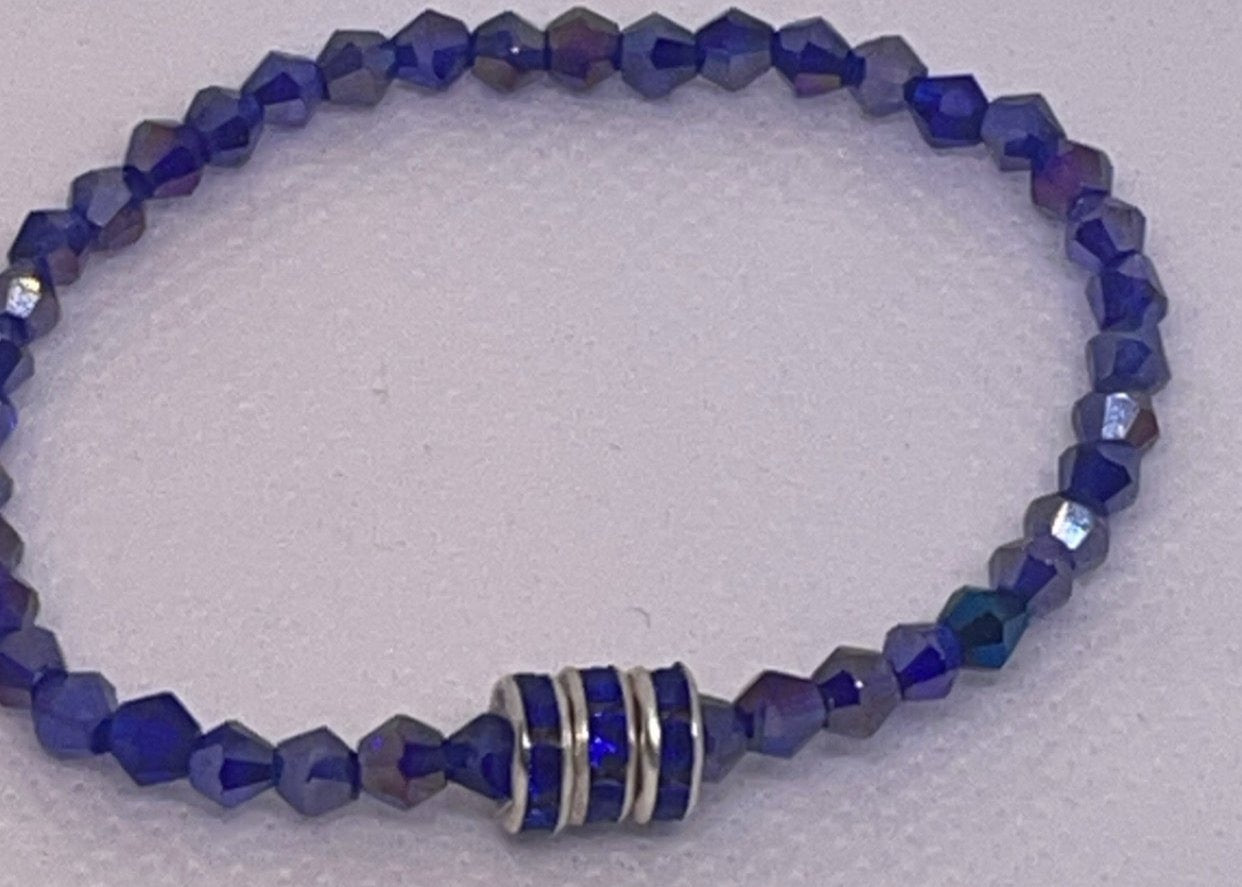 Sapphire blue crystal bracelet with clear crystal accents and silver rondelle