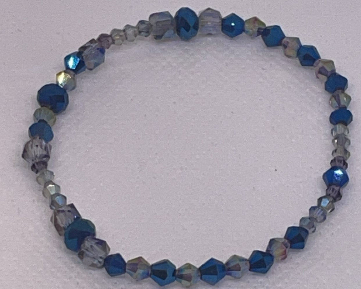 Iridescent blue and clear crystal bracelet with aurora borealis finish