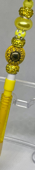 Sunflower-inspired beaded pencil with vibrant accents, perfect for cheerful writing.