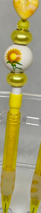 Sunflower-inspired beaded pencil with vibrant accents, perfect for cheerful writing.